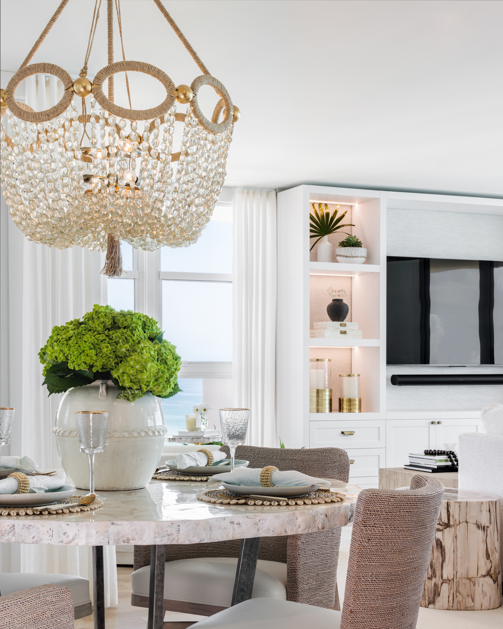 Stunning dining table set with sparkling chandelier curated by Miami Beach interior designer, DLT Interiors.
